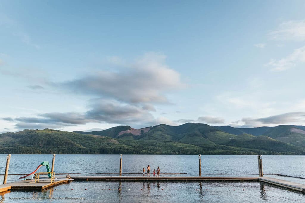 Scenic lake view with distant mountains and dock