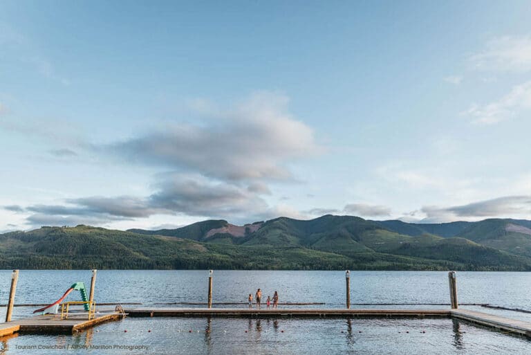 Scenic lake view with distant mountains and dock